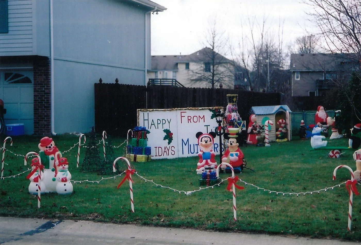 The Happy Holidays from the Muillers sign with candy canes and snowmen in 2009